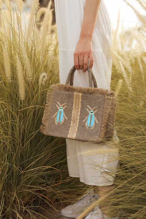 Blue and gold insects tote