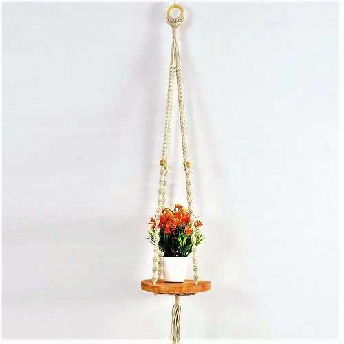 Macrame wall hanging with round shelf