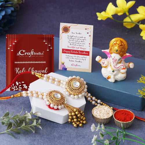 Golden & White Beads, Pearl, Diamond Designer Bhaiya Bhabhi Rakhi Set, Lord Ganesha Idol, Roli Chawal Pack, Greeting Card