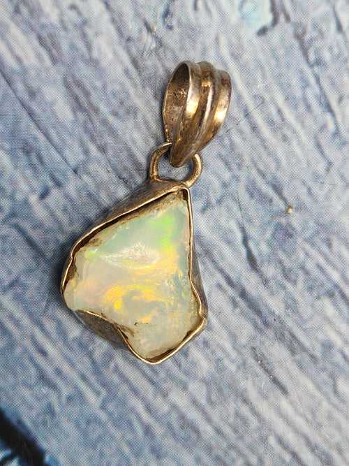 Ethiopian Opal Rough Single Stone Pendant in Silver - Enchanting Opal Brilliance