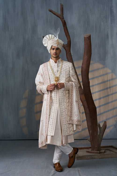 Ivory Sherwani Paired With Anarkali In Self Weave Butti Motif
