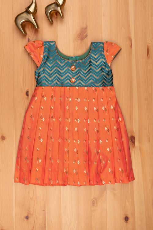 Zesty Orange Meets Peacock Blue Semi Silk Cotton Pattu Gown for Stylish Young Ladies.