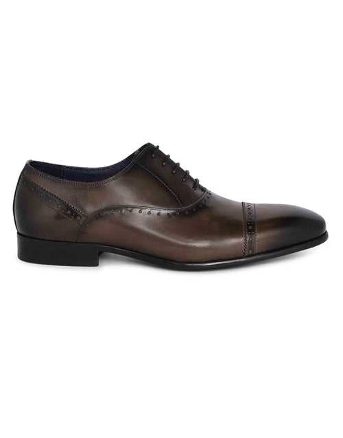 Grey medallion wingtip oxfords