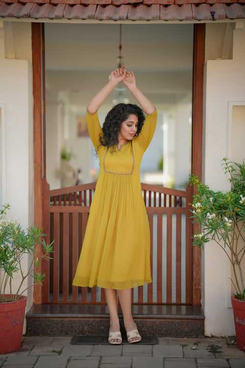 Yellowish green self lined georgette Aline kurti with handworked yoke and gathers