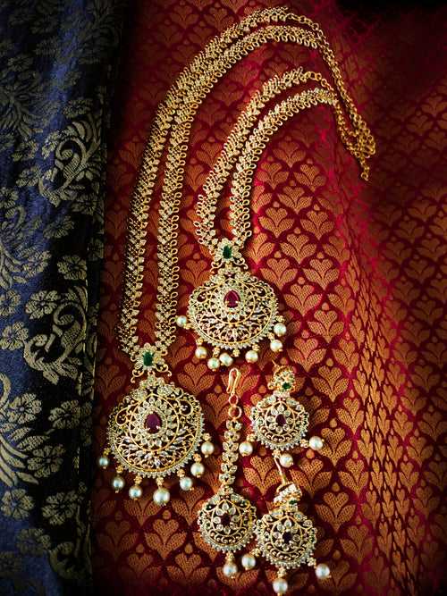 N03032_Bridal Gorgeous  designer gold polished American diamond embellished necklace set with one short & one long designer necklace set, grand earring and maangtika