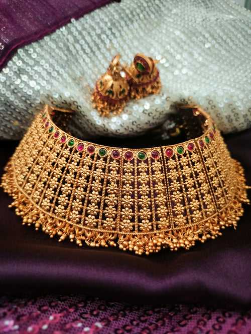 N03064_ Grand classic matte gold polished temple jewelry choker style crafted design gold plated necklace set embellished with multicolor stones .