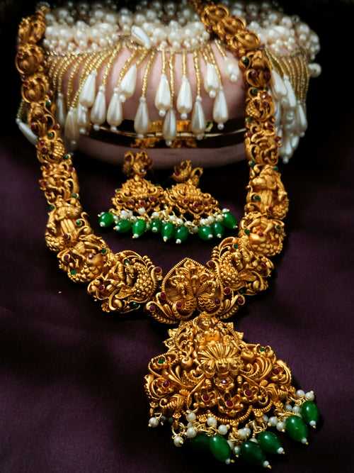N03078_ Grand classic matte gold polished temple jewelry Long Haram & grand choker crafted design gold plated necklace set embellished with green stones .