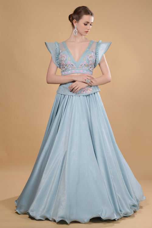 Light blue crop top and long skirt set.