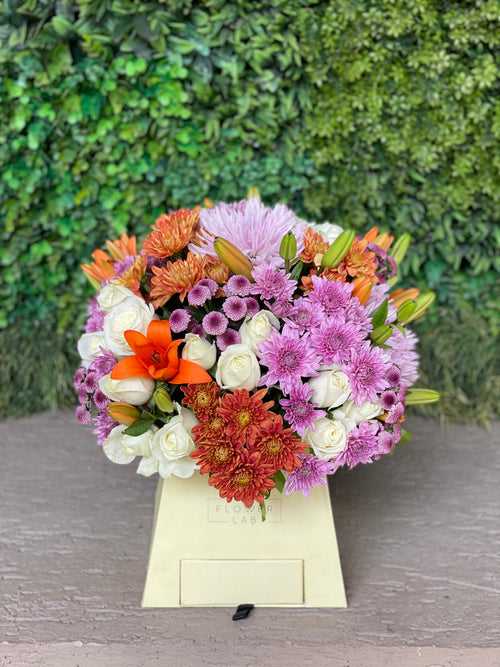 Mixed Blooms in a Yellow Paper Box