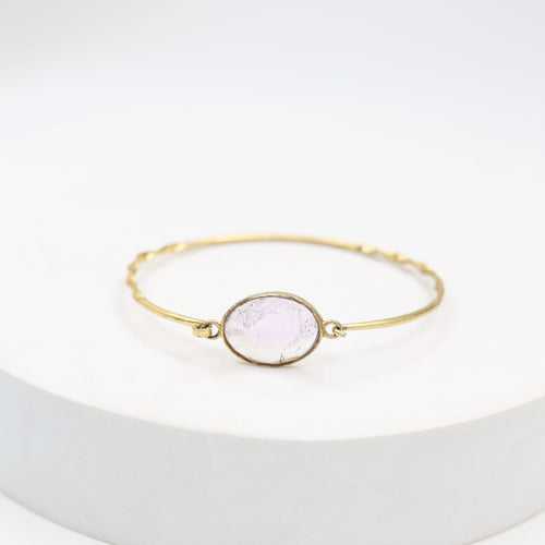 Handcrafted Amethyst bracelet in sterling silver studded with faceted amethyst stone in 1 micron gold plating.