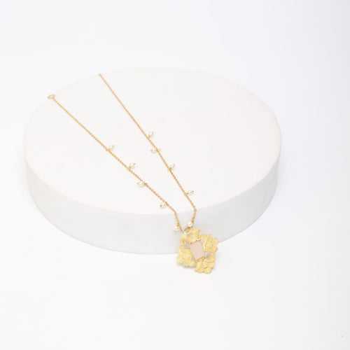 Sterling Silver Pendant necklace with rose Quartz and textured leaves motif in 18 karat Gold plating.