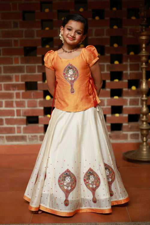 Valkannadi Printed Kids Skirtset with Embroidered Top with Tie-up- Orange & Off-White