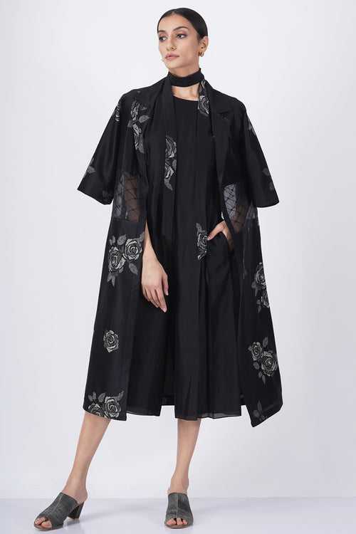Monochrome rose print sheer waist jacket with solid black jumpsuit