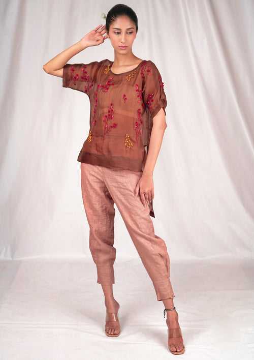 Pink linen trousers with fitted band hemline.
