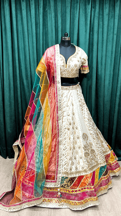 Cream Banarsi Silk Lehenga With Zari, Mirror And Multi Colour Border