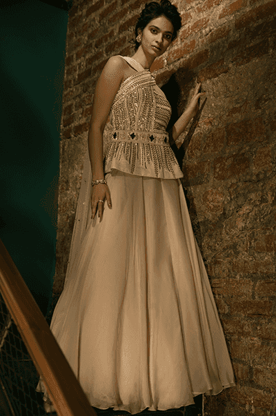 <b>SANYA GULATI</b><br>Ivory Peplum Crisscross Top with Skirt