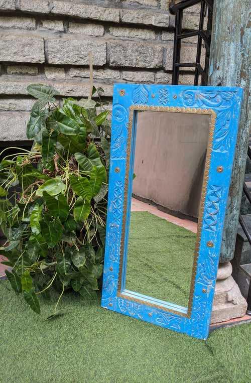 Bright Blue carved wooden mirror with brass details