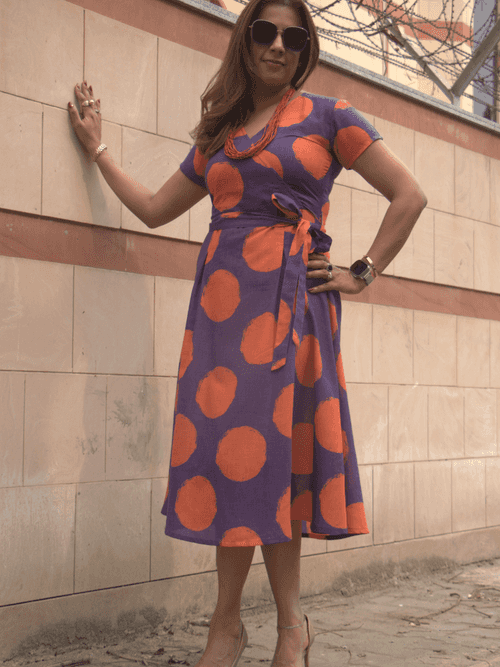 Orange and purple fit and flare dress with a belt