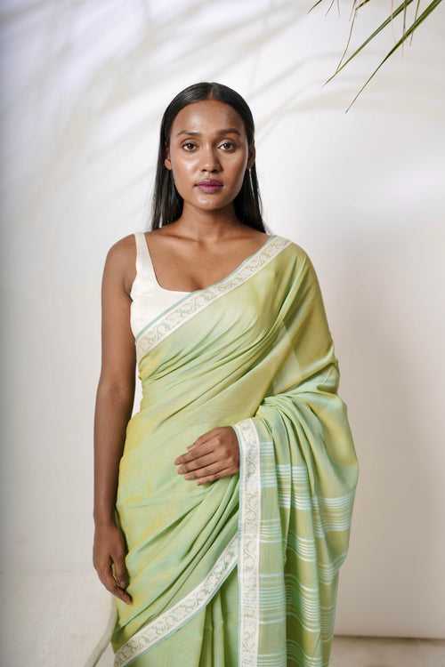 Luminous I  Light green cotton saree with white border