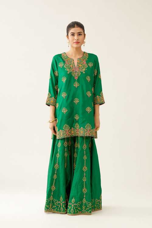 Green silk short kurta set, with dori & silk thread embroidery highlighted with contrast bead & sequins work.