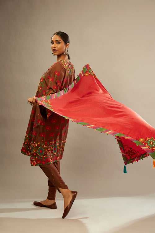 Light silk red scarf with a bold striped silk border edged with multi-colored silk tassels on all four sides.