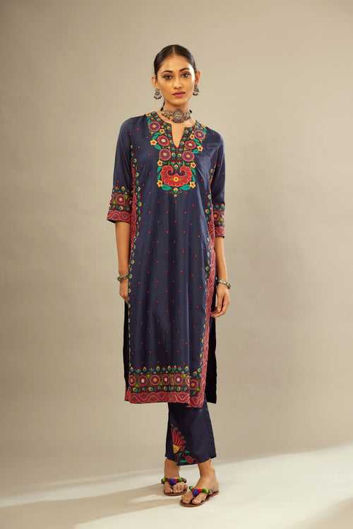 Indigo slim fit straight kurta set, decorated with bold appliqué borders all along the side seam, hem and sleeve cuffs.