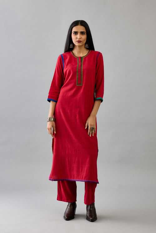 Red handloom cotton straight kurta set with multi colored silk facings and embroidery detail.