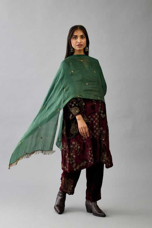 Green light silk stole with all-over small embroidered booti and fringes at sides.