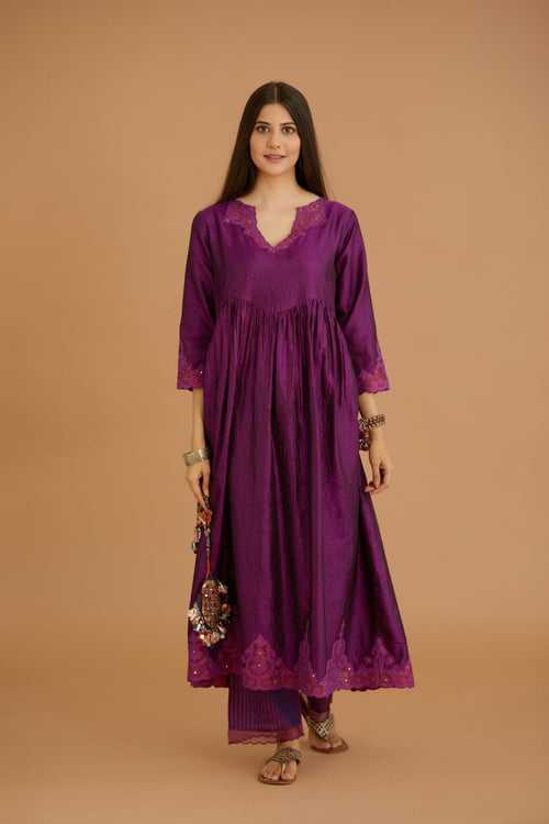 Purple hand crushed silk kurta with wavy empire waistline and gathers, with silk and organza cutwork embroidery, highlighted with hand attached mirrors.