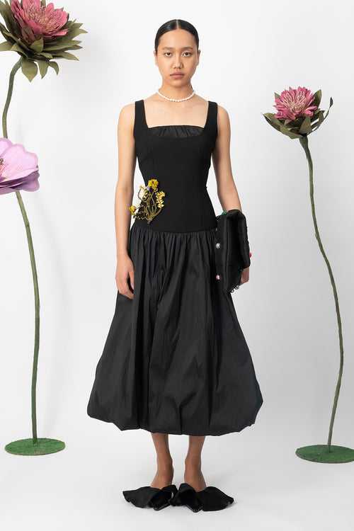black magnolia dress with handcrafted bouquet brooch