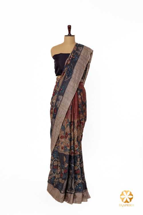 Handcrafted Tussar Silk Saree with Natural Kalamkari Floral Theme, Woman on Palla, and Hand-Embroidered Mirrors
