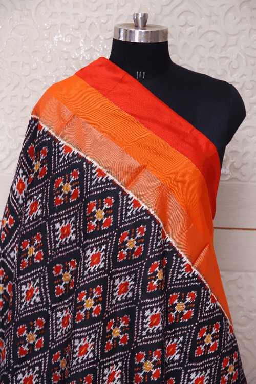 Single ikat dupatta in traditional Paan Chanda design in Black and Orange combination