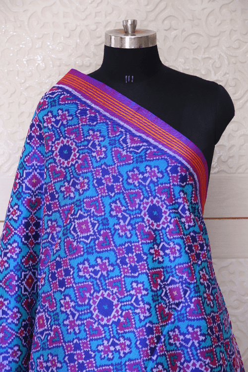 Semi double ikat dupatta in Sky Blue and Purple colour with traditional manekchowk and navratna design