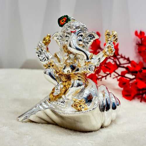 999 Silver Lord Ganesha on a Shankh Perfect for home decor or as a unique gift, this piece is both visually stunning and spiritually uplifting. The intricate details and high-quality silver make it a must-have for any spiritual or decorat