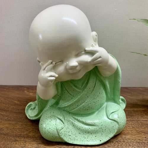 Laughing baby Buddha monk idol.