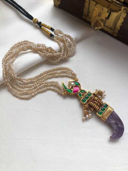 Antique pearls with kundan and tiger nail violet rhodolite pendant