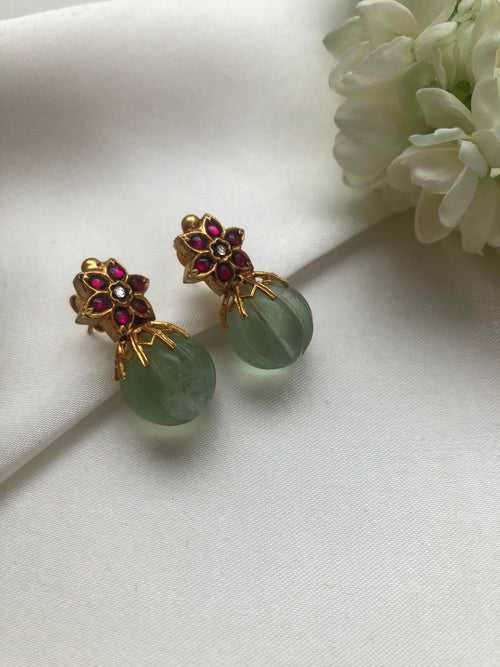 Kundan ruby flower earrings with green pumkin bead
