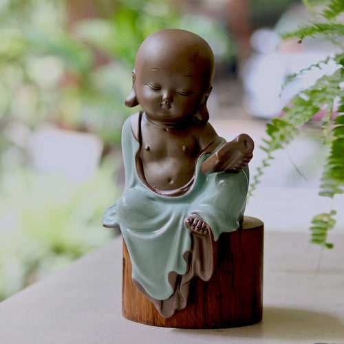 Ceramic Buddhist Monk Figurine with Book