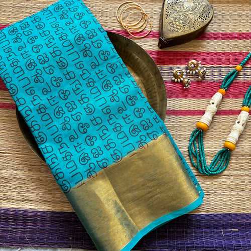 Teal squeal Venkatagiri saree with Tamil script print