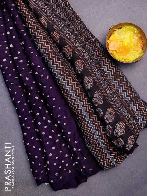 Modal silk saree deep violet and black with allover bandhani prints and ajrakh printed pallu