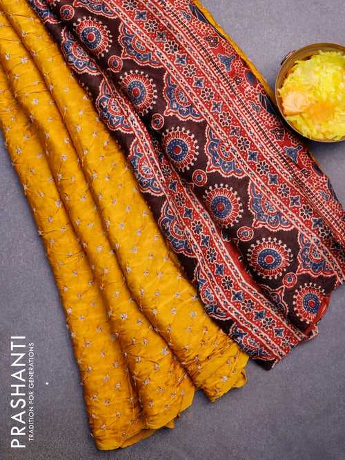 Modal silk saree mustard yellow and maroon with allover bandhani prints and ajrakh printed pallu