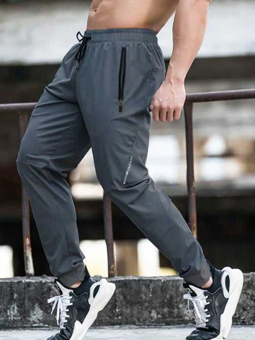 Drawstring Waist Zipper Pocket Sports Trousers