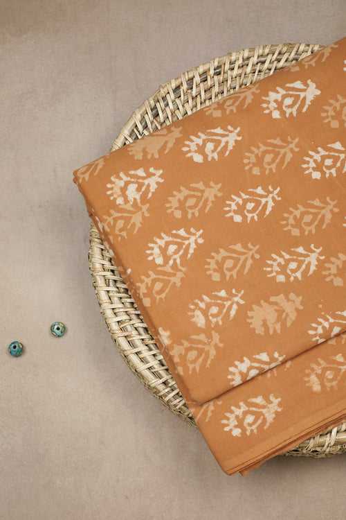 Motifs on Orange Dabu Cotton Fabric
