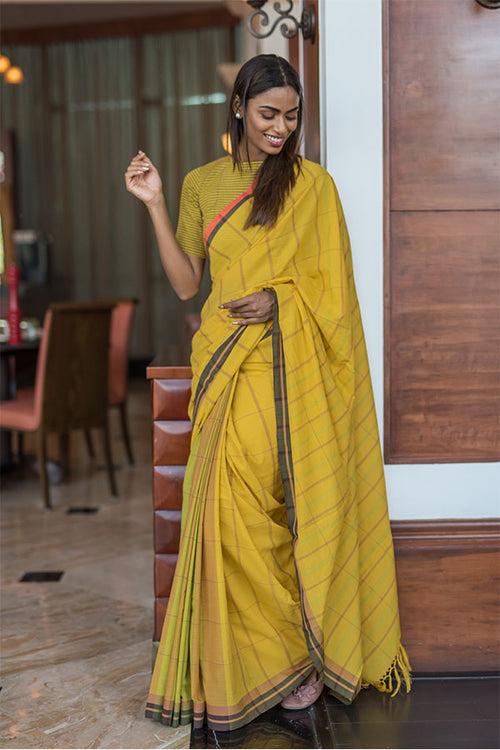 Turmeric-cinnamon cotton saree.