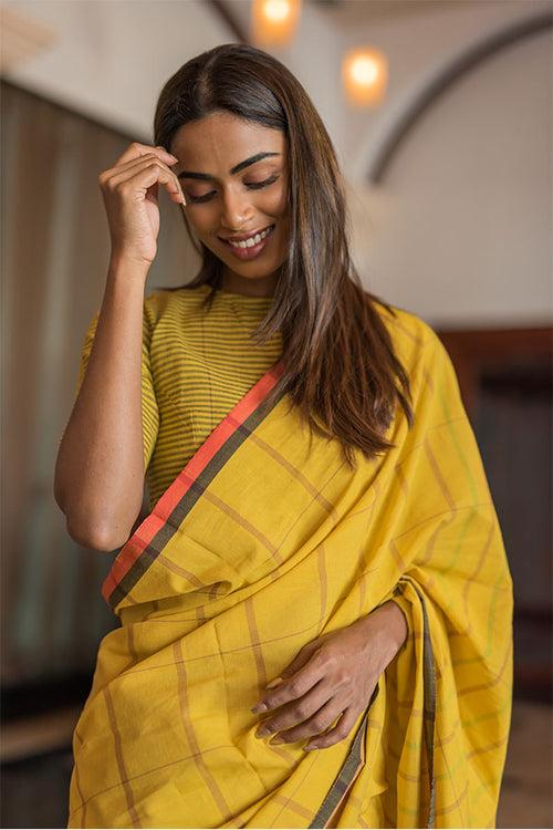 Turmeric-cinnamon cotton saree.