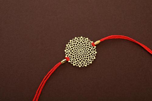 Lotus design Rakhi cum keychain ring for Bhai/brother crafted in brass with golden finish