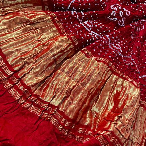Deep red bandhani saree with zari pallu