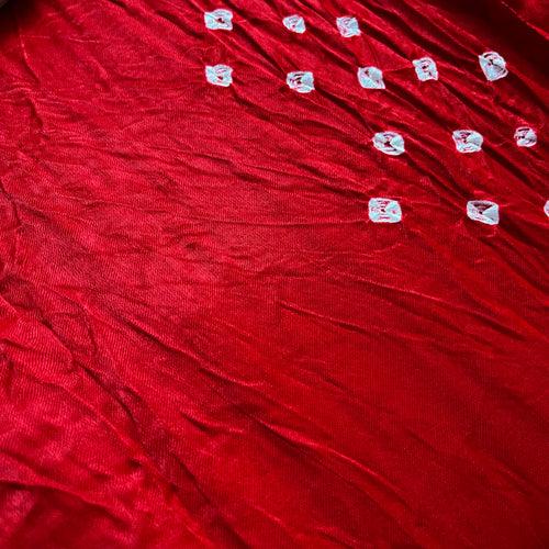 Deep red bandhani saree with zari pallu