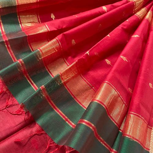 Dark green and red maheshwari saree with flower bootis all over