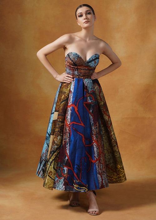 A fun printed tube gown with smart pleats in cotton silk.